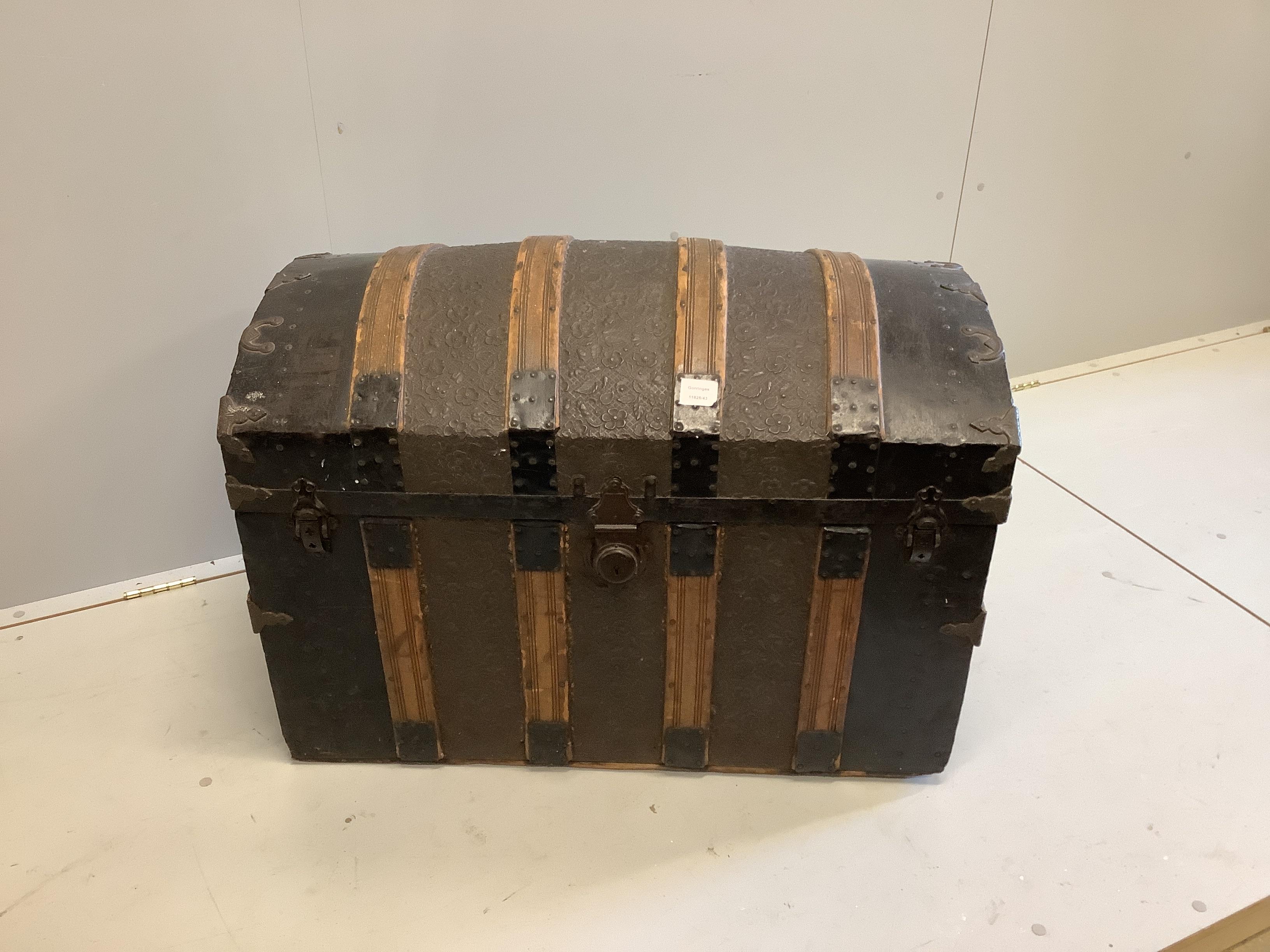 A Victorian embossed leather, wood and metal domed topped trunk, width 87cm, depth 48cm, height 64cm